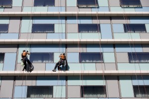 bigstock-Workers-washing-the-windows-fa-30667373