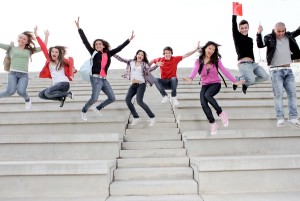 group students jumping end of exam year