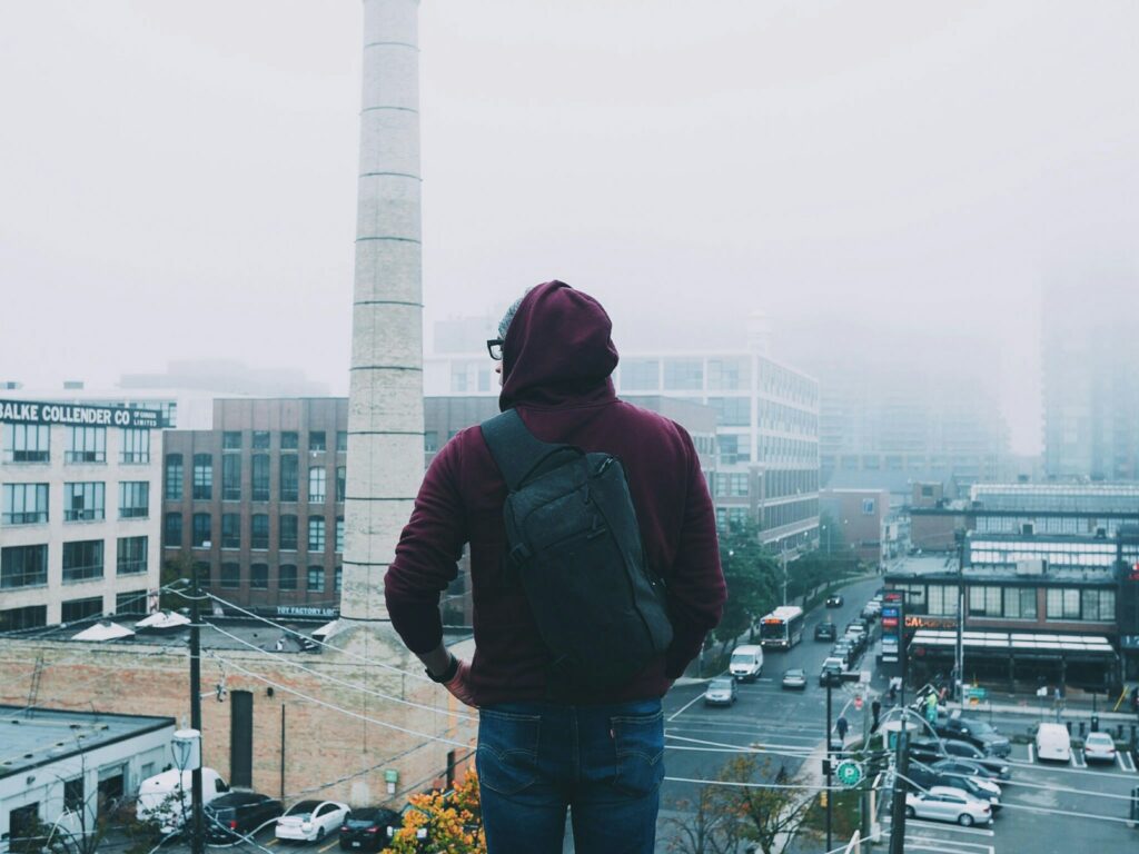 Person with a backpack looking over Toronto.
