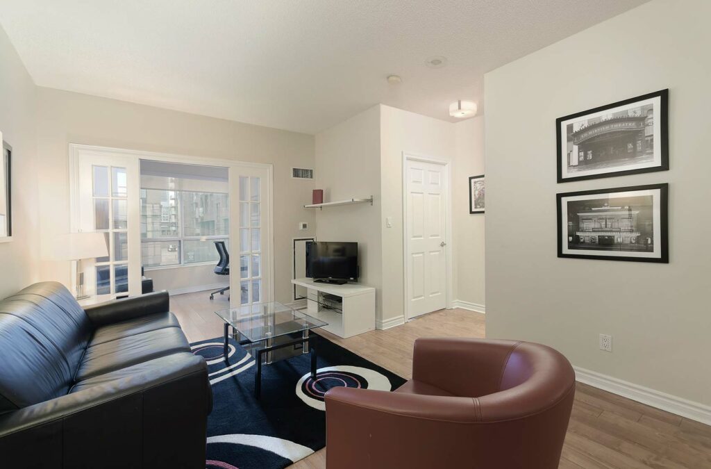 Modern living room area and den with workspace.